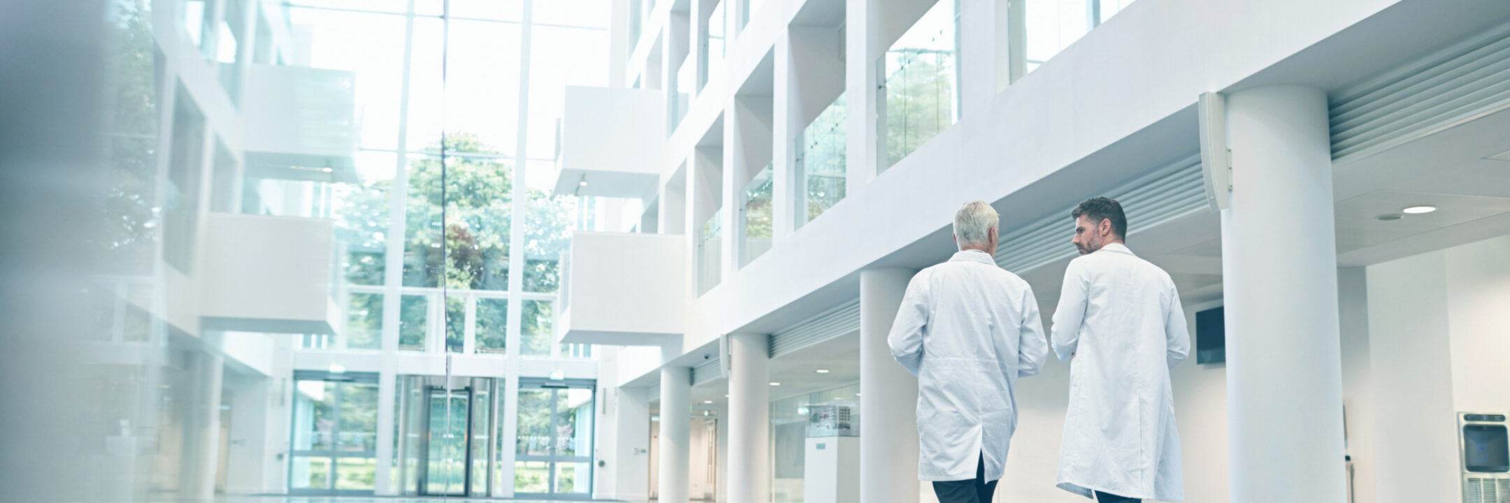 Hospital corridor with two doctors walking