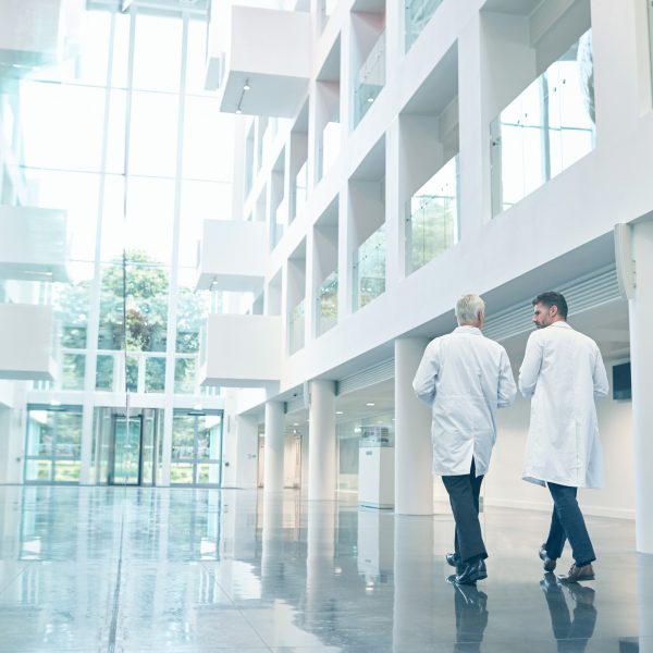 Hospital corridor with two doctors walking