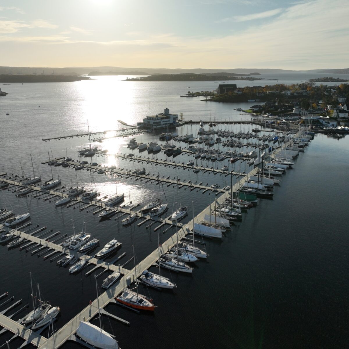 Marina in Oslo with many boats, bathed in sunshine